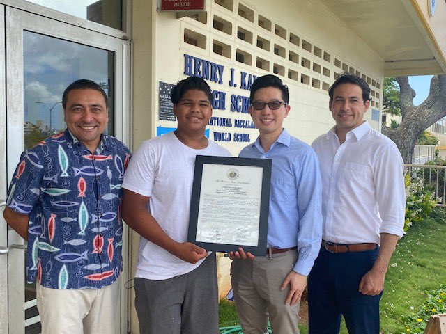 (left to right) Senators Mark Hashem, Stanley Chang and Chris Lee present Cadet Judah Danganan (middle left) with the proclamation of his receiving of the Gold Valor Award.