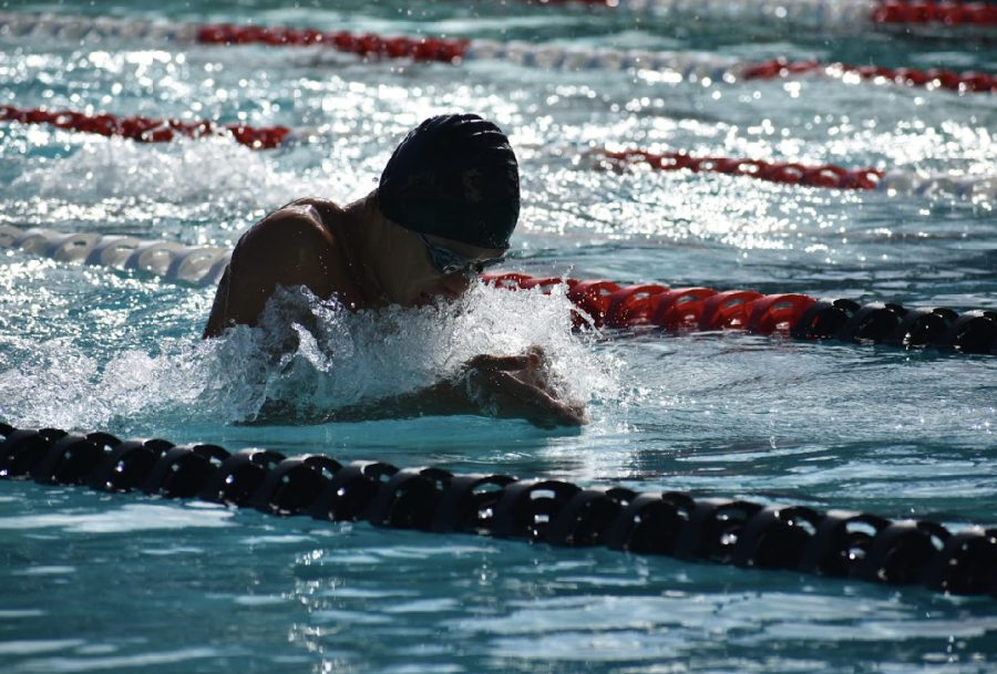 Kaiser swimmer is racing in the breaststroke. 