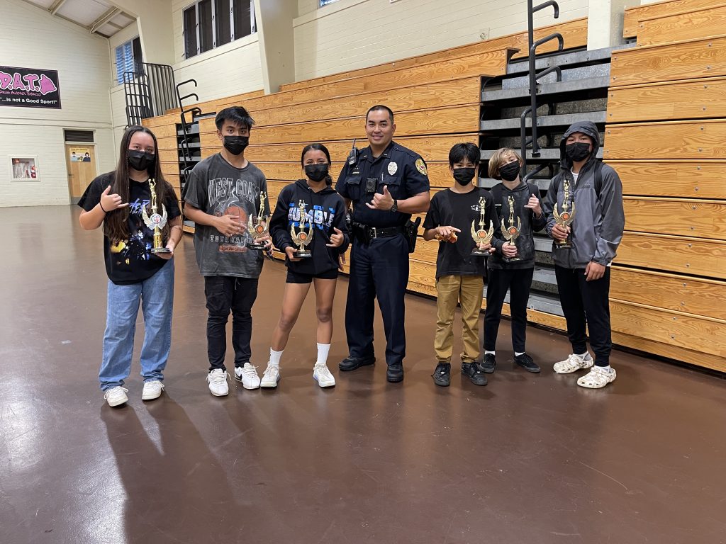 Hawaii County School Resource Officer Blake Ragocos bonding with students.